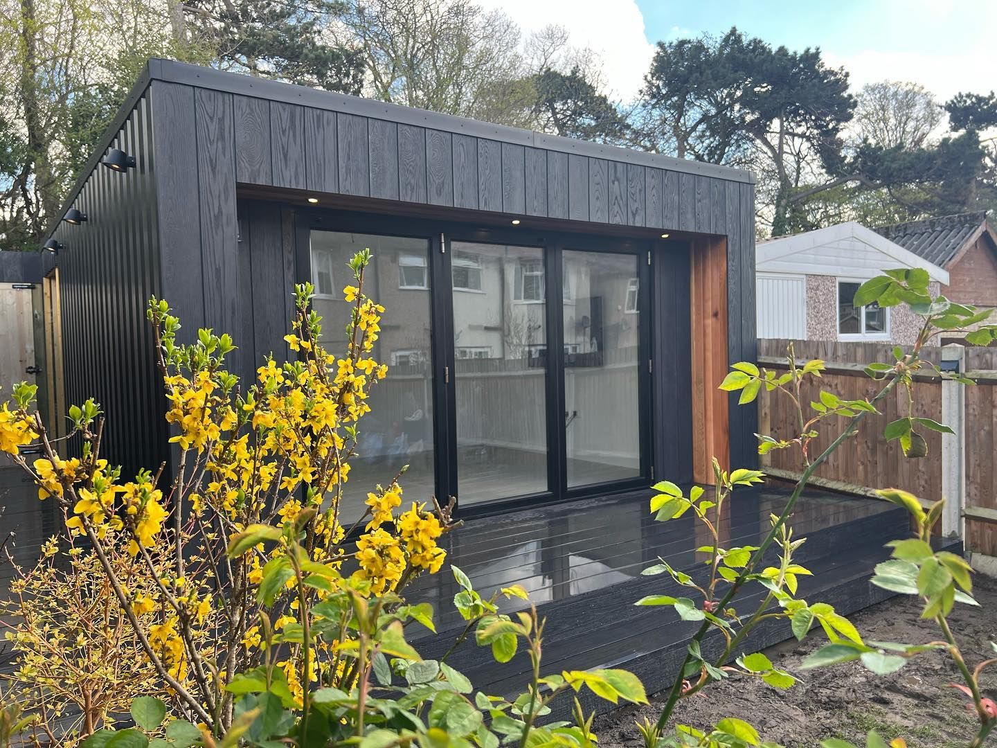 A bespoke insulated OuterRoom garden room with timber and glass, built in a Surrey garden